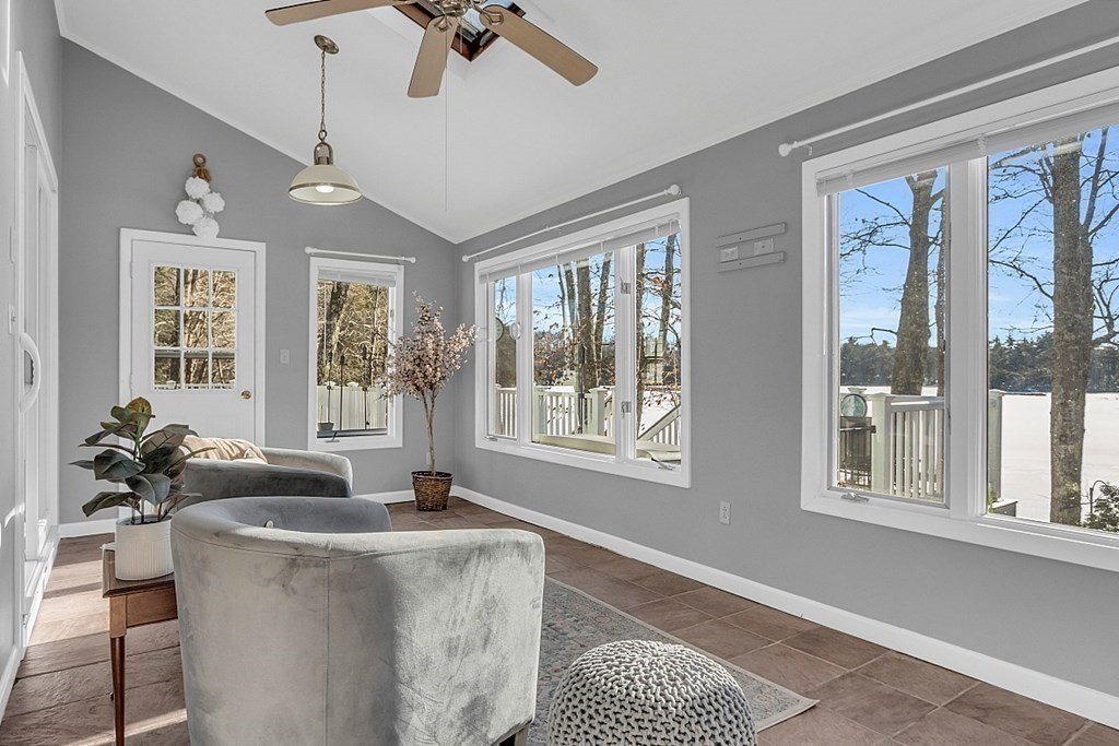 105 Secret Lake Road Phillipston, MA 01331 - Photo 19 of 42 a living room with furniture and floor to ceiling windows