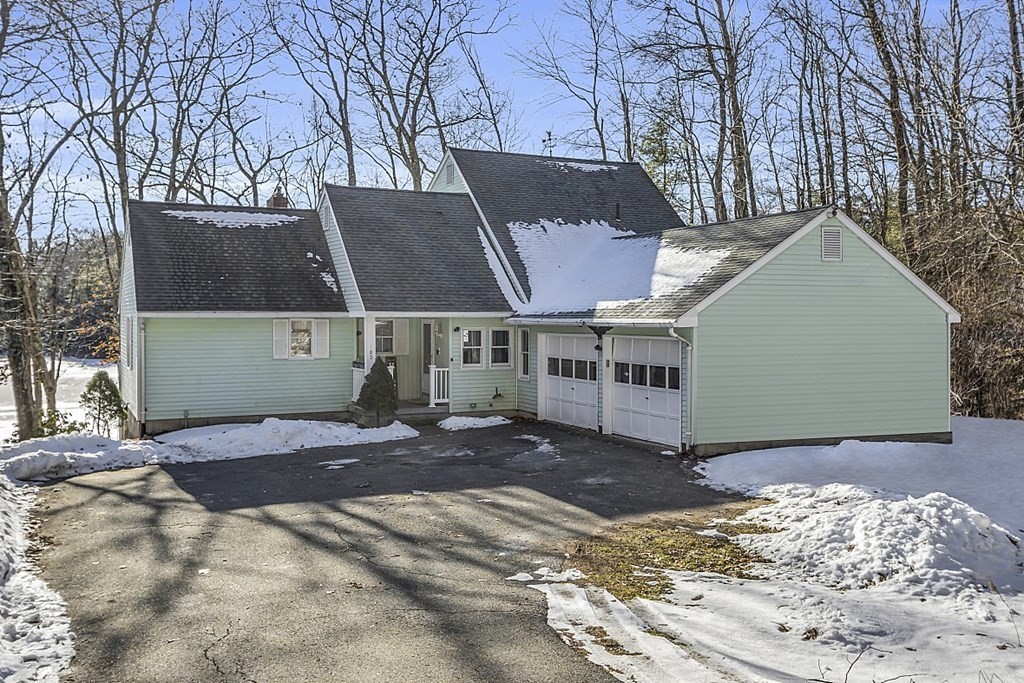 105 Secret Lake Road Phillipston, MA 01331 - Photo 2 of 42 a view of a house with a snow