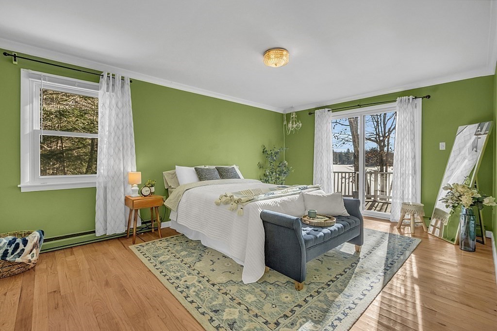 105 Secret Lake Road Phillipston, MA 01331 - Photo 21 of 42 a bed room with a bed and a chair