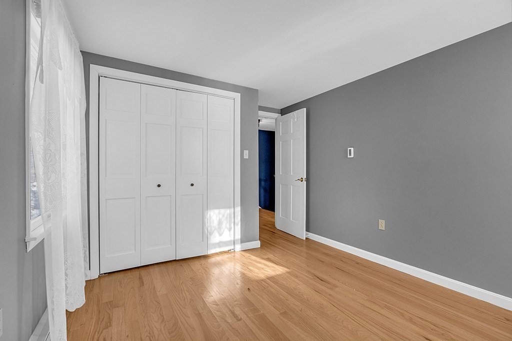 105 Secret Lake Road Phillipston, MA 01331 - Photo 32 of 42 a view of an empty room with wooden floor