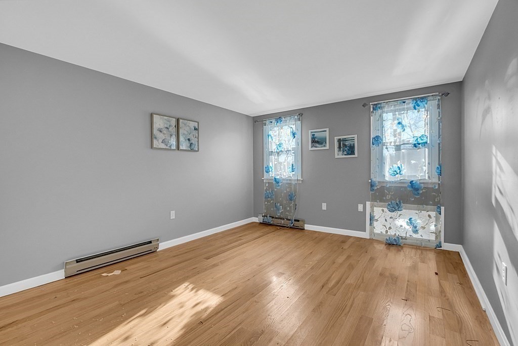 105 Secret Lake Road Phillipston, MA 01331 - Photo 33 of 42 wooden floor in an empty room with a window