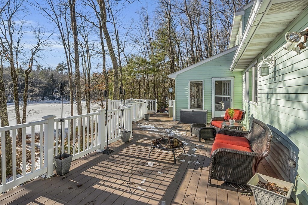 105 Secret Lake Road Phillipston, MA 01331 - Photo 38 of 42 a view of a deck with couches and wooden floor