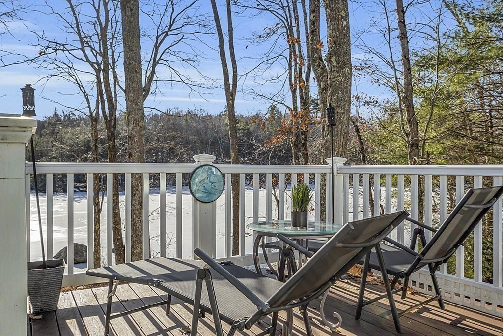 105 Secret Lake Road Phillipston, MA 01331 - Photo 5 of 42 a view of a chairs and table in the balcony