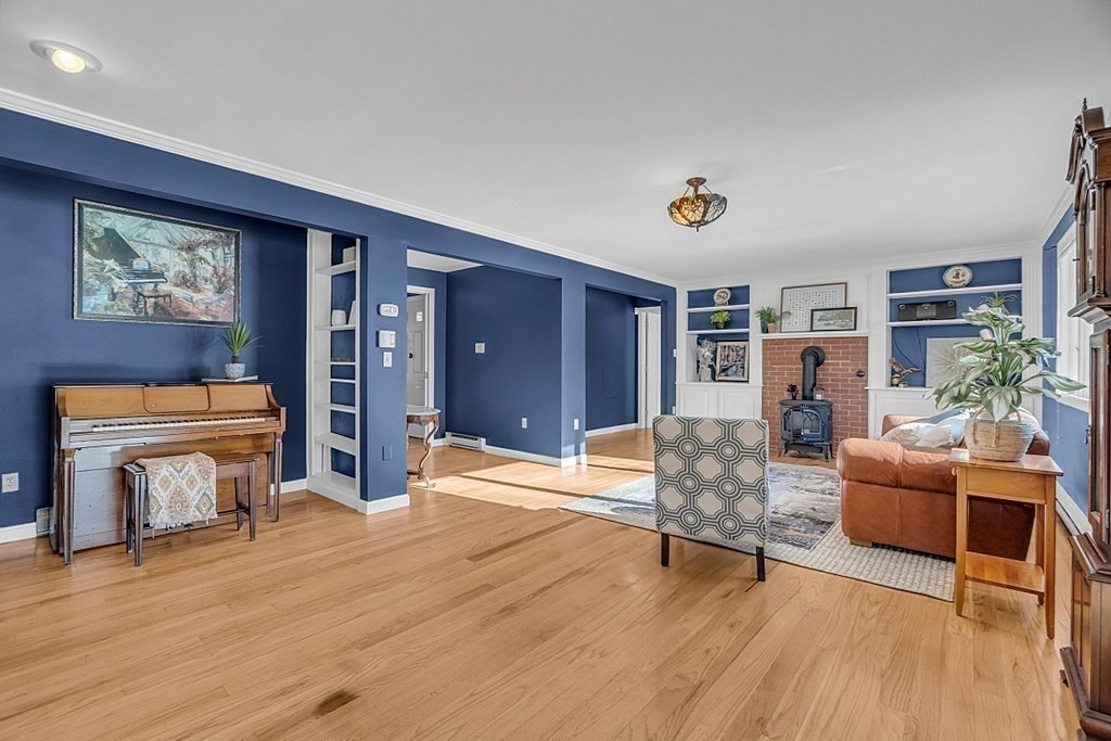105 Secret Lake Road Phillipston, MA 01331 - Photo 9 of 42 a living room with furniture and a wooden floor