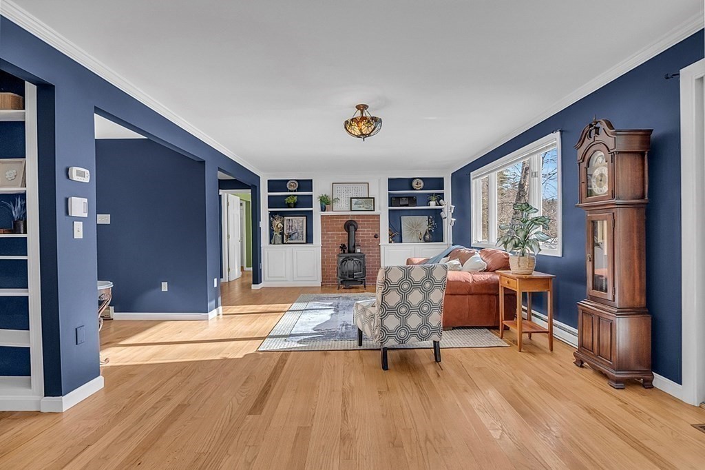 105 Secret Lake Road Phillipston, MA 01331 - Photo 10 of 42 a living room with furniture and a wooden floor