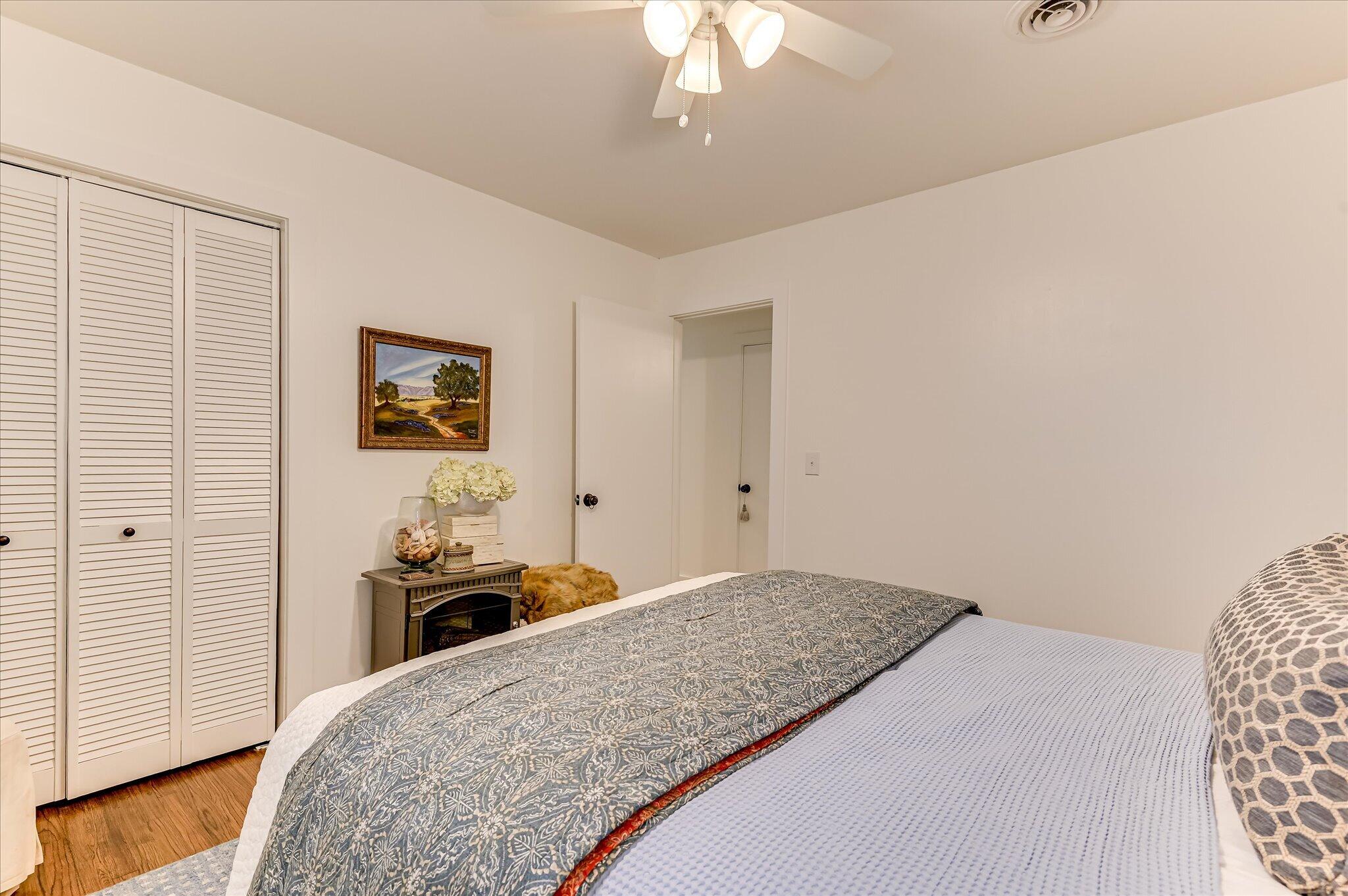 1121 Ridgecrest Avenue North Augusta, SC 29841 - Photo 29 of 42 a bedroom with a bed and a chandelier
