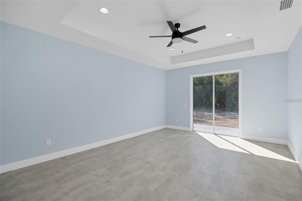 12222 Southwest 95th Place Dunnellon, FL 34432 - Photo 11 of 17 a view of a livingroom with a ceiling fan and window