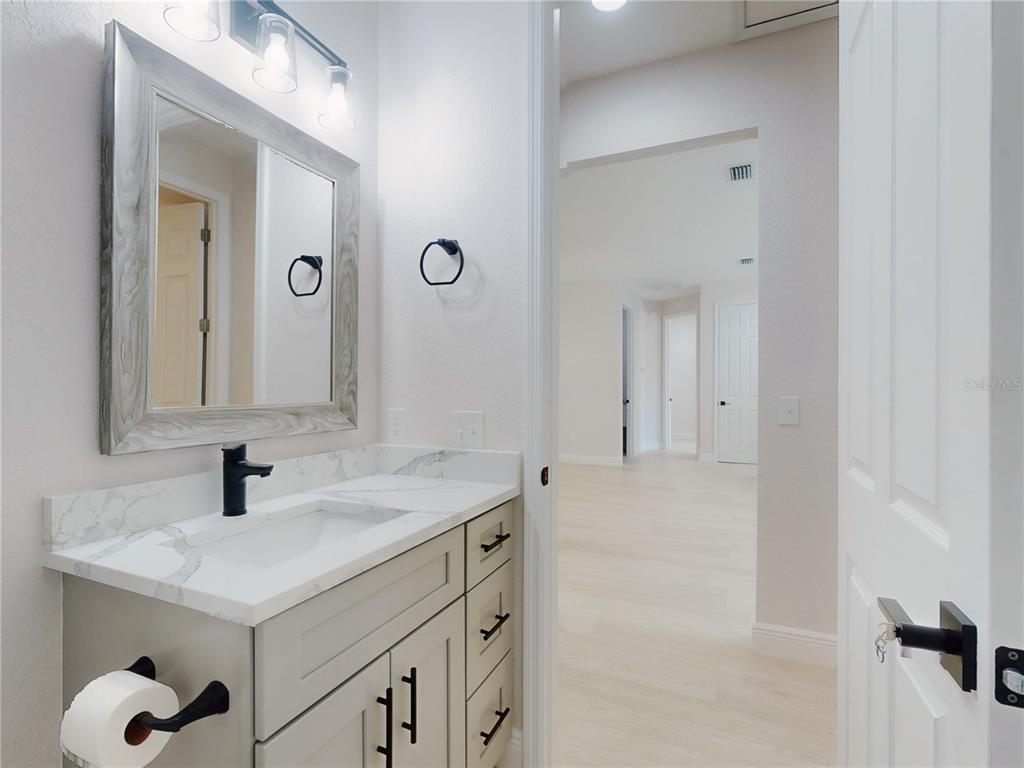 12222 Southwest 95th Place Dunnellon, FL 34432 - Photo 20 of 23 a bathroom with a sink and a mirror