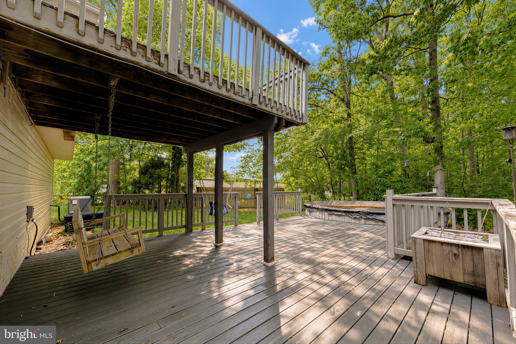 23801 McIntosh Road Hollywood, MD 20636 - Photo 3 of 35 a view of a deck with wooden floor and outdoor space