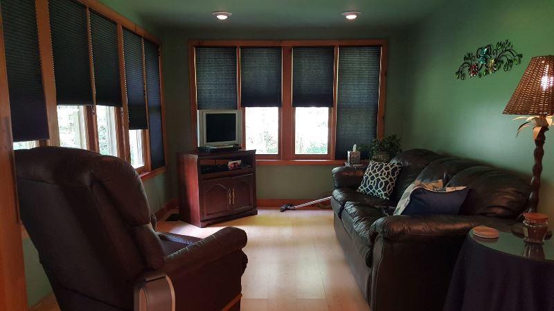 429 Roland Branch Road Henry, VA 24102 - Photo 13 of 33 a living room with furniture and a flat screen tv