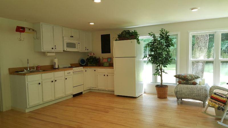 429 Roland Branch Road Henry, VA 24102 - Photo 22 of 33 a kitchen with sink a refrigerator and wooden cabinets