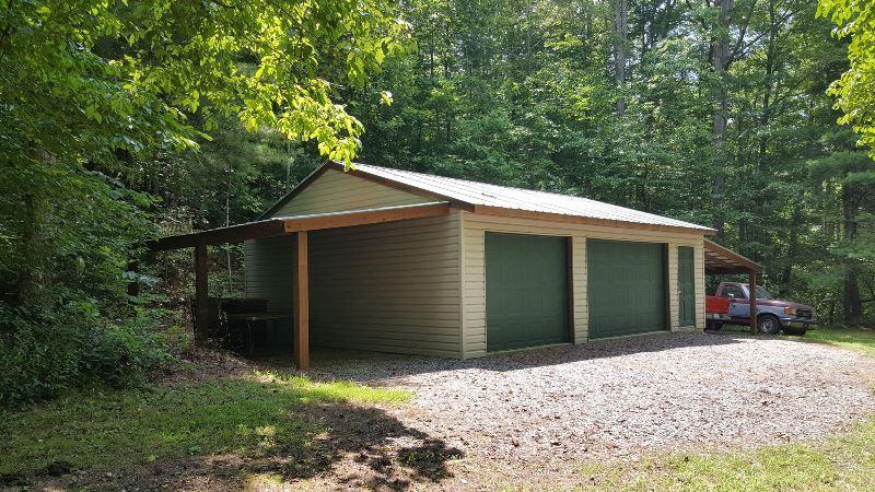 429 Roland Branch Road Henry, VA 24102 - Photo 6 of 33 a view of a house with a yard and garage