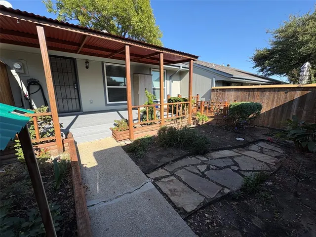 a front view of house with outdoor seating