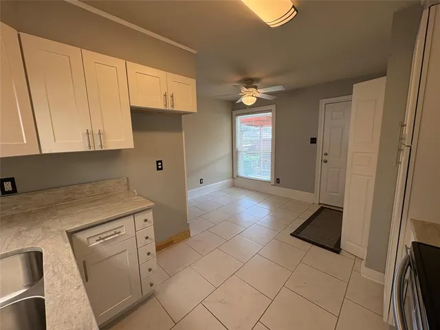 a view of a kitchen with electric appliances