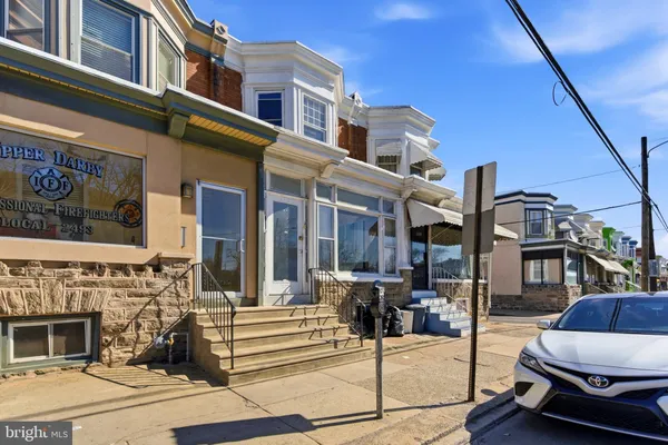 a view of a building with sitting area