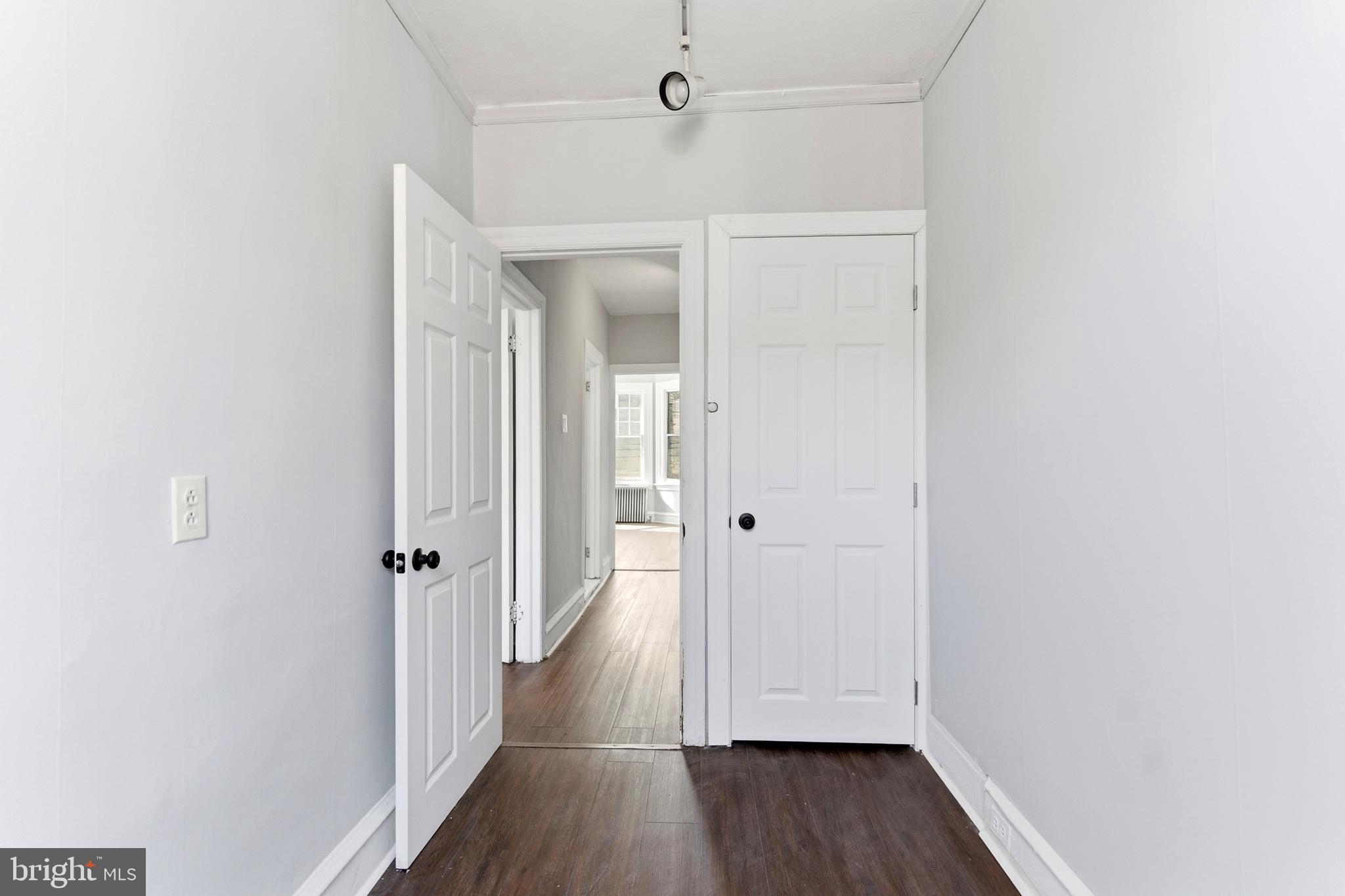 7233 West Chester Pike Upper Darby, PA 19082 - Photo 14 of 14 a view of a hallway with wooden floor