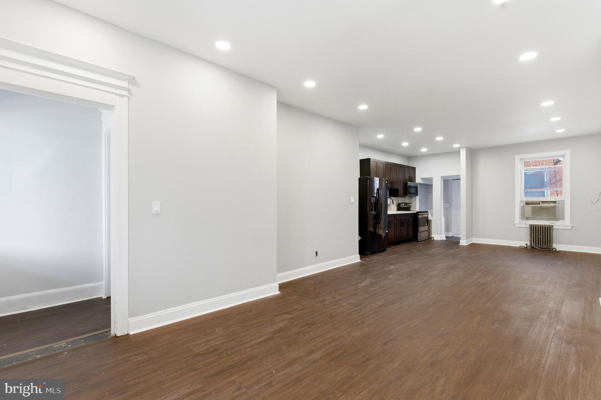 7233 West Chester Pike Upper Darby, PA 19082 - Photo 4 of 14 a view of empty room with wooden floor