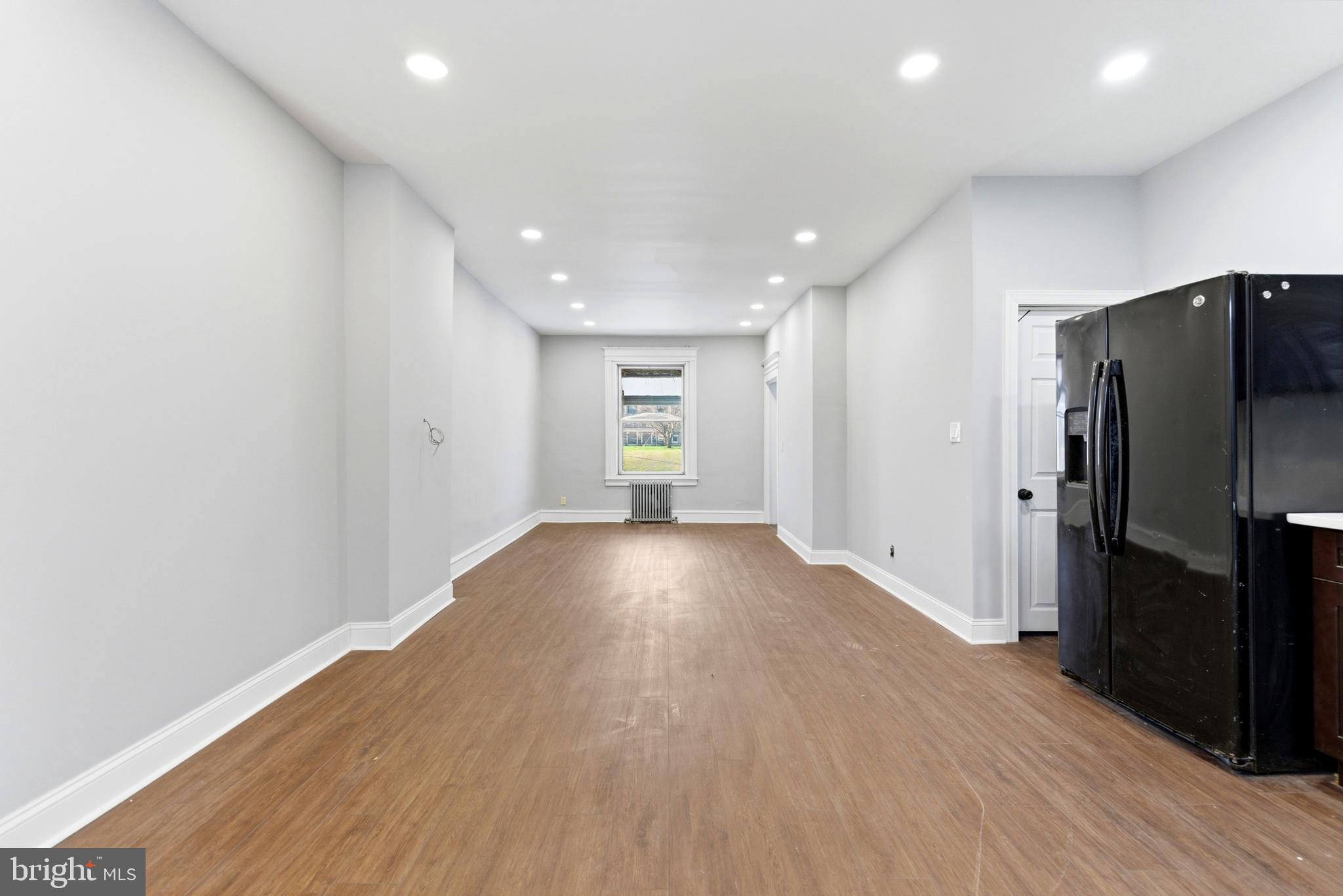7233 West Chester Pike Upper Darby, PA 19082 - Photo 7 of 14 a view of empty room with wooden floor