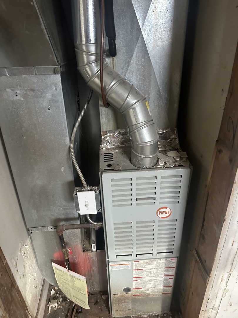 11809 South Indiana Avenue Chicago, IL 60628 - Photo 15 of 21 a close view of water heater room