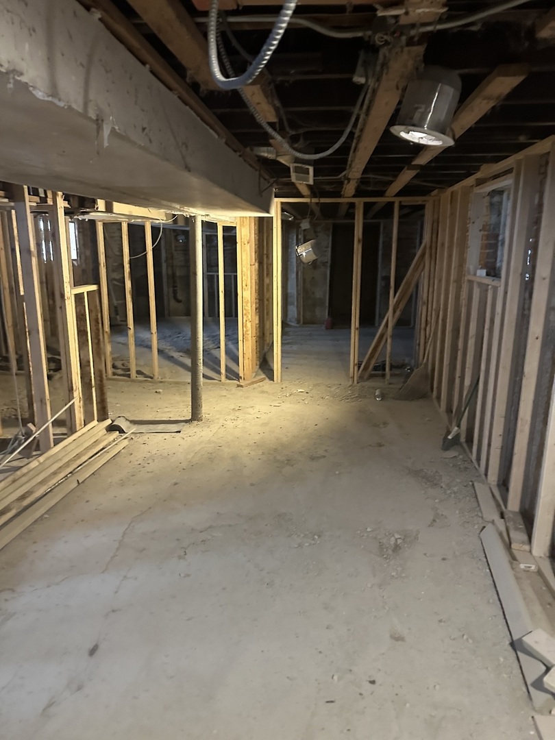 11809 South Indiana Avenue Chicago, IL 60628 - Photo 17 of 21 a view of an empty room with wooden floor