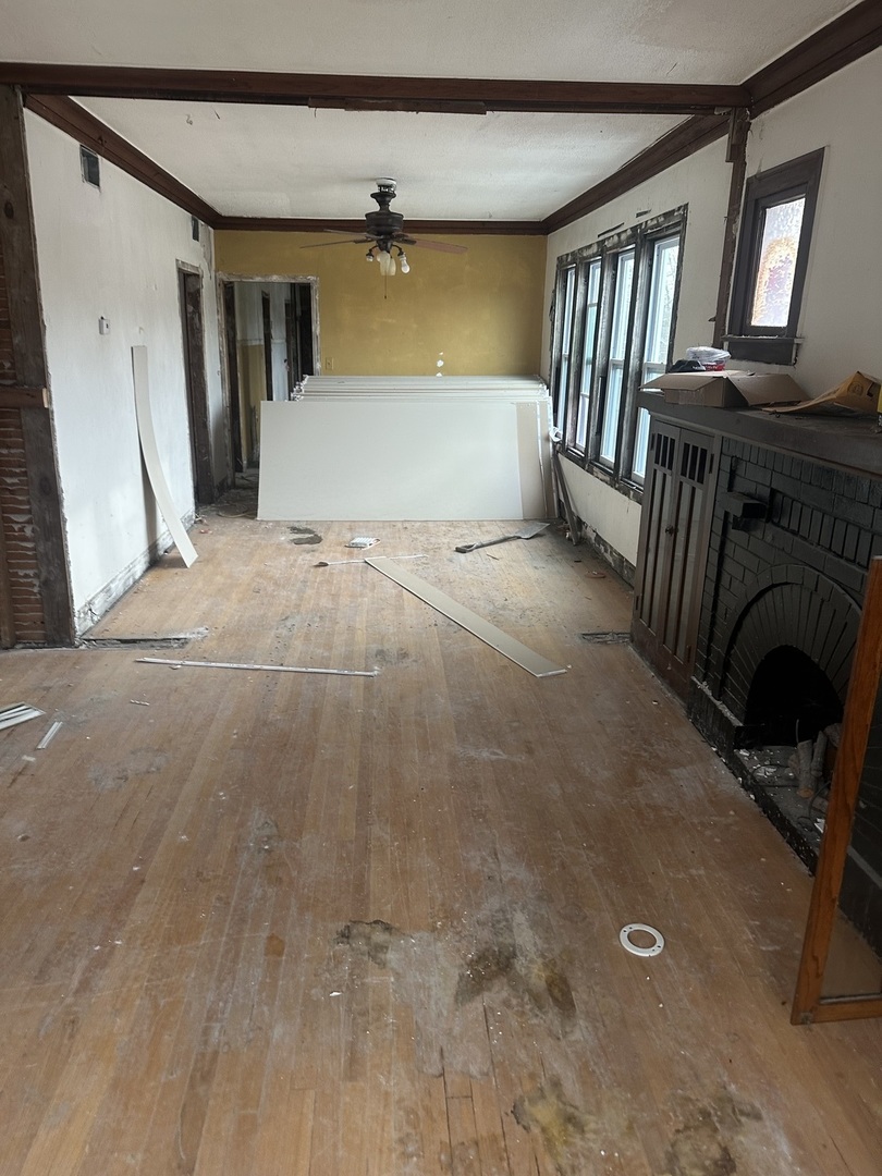 11809 South Indiana Avenue Chicago, IL 60628 - Photo 3 of 21 a view of livingroom with furniture and staircase
