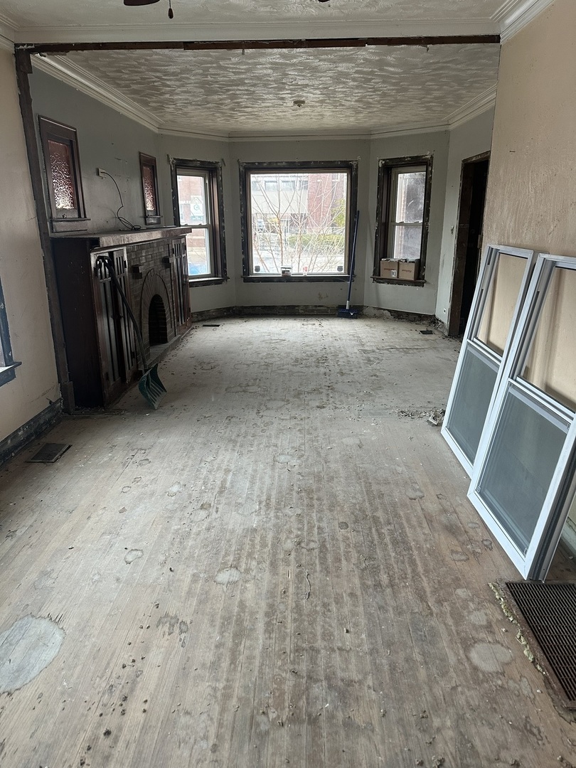 11809 South Indiana Avenue Chicago, IL 60628 - Photo 4 of 21 a view of a hallway with windows