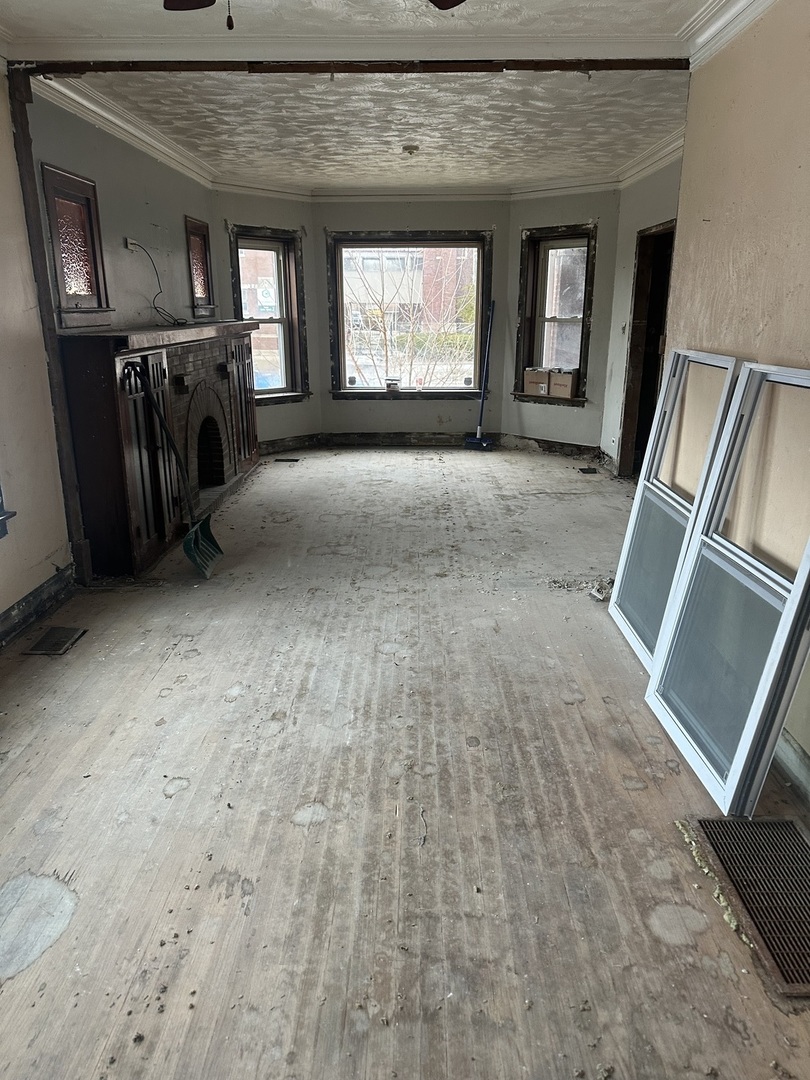 11809 South Indiana Avenue Chicago, IL 60628 - Photo 5 of 21 a view of a livingroom with a fireplace