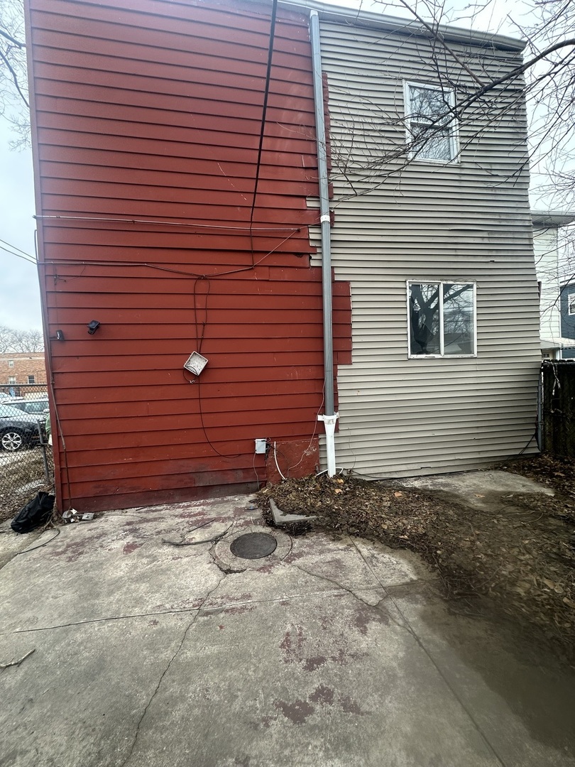 11809 South Indiana Avenue Chicago, IL 60628 - Photo 6 of 21 a view of a backyard with brick wall