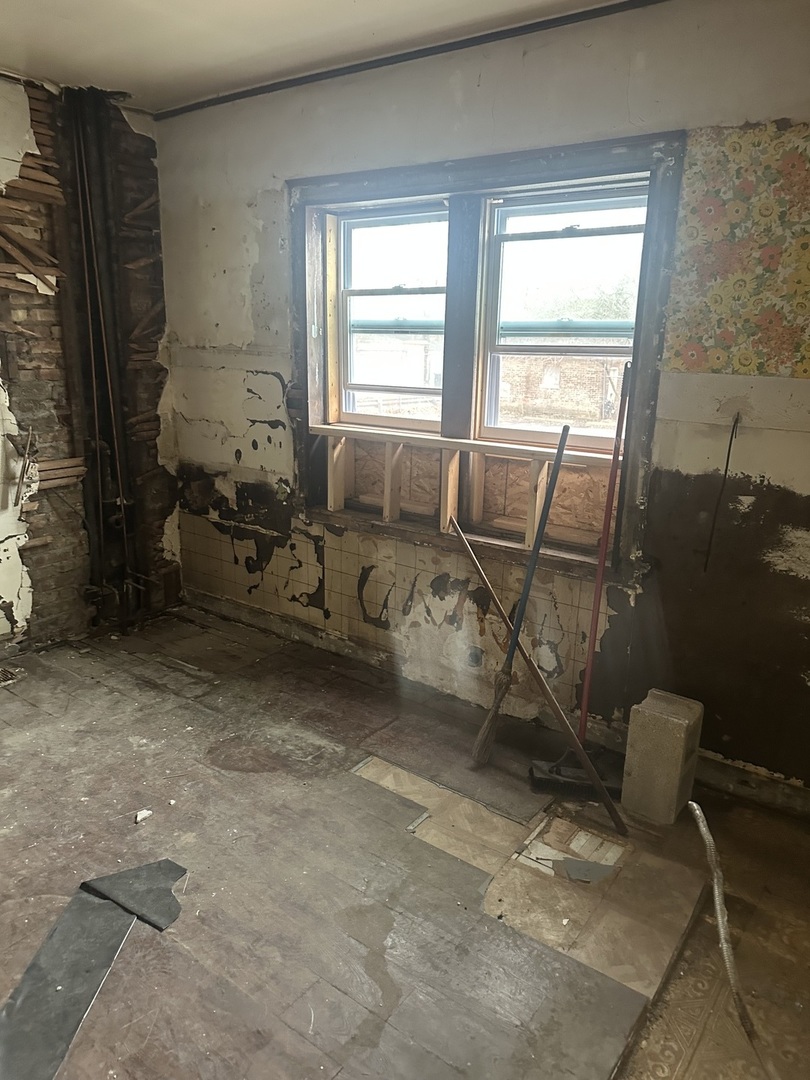 11809 South Indiana Avenue Chicago, IL 60628 - Photo 9 of 21 a living room with furniture and a window