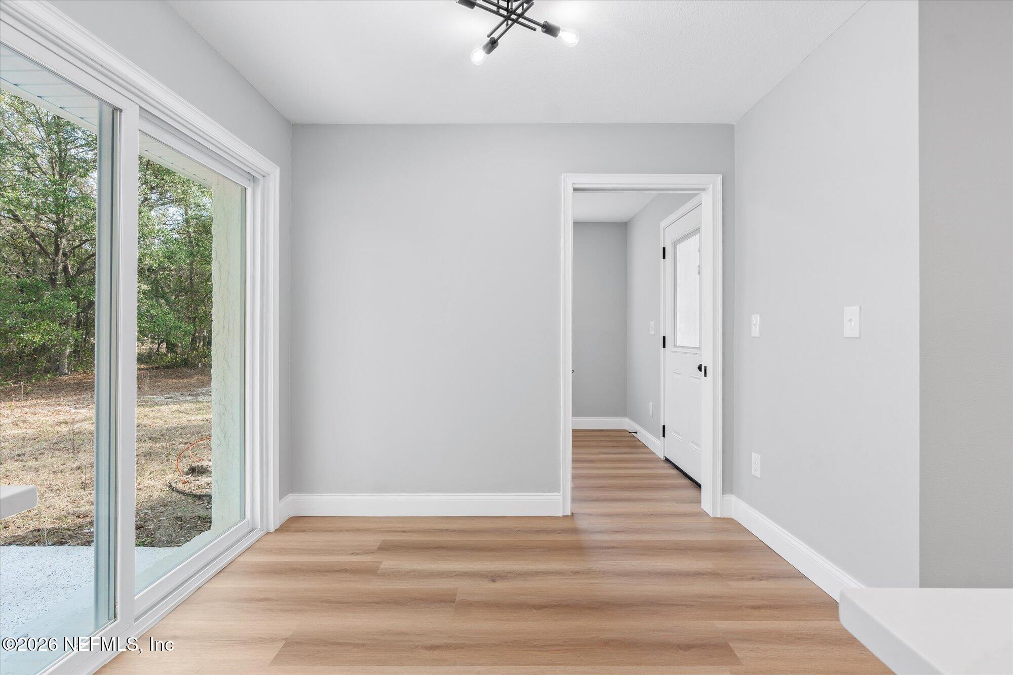 102 Mullins Road Interlachen, FL 32148 - Photo 12 of 45 a view of a hallway with wooden floor and a balcony