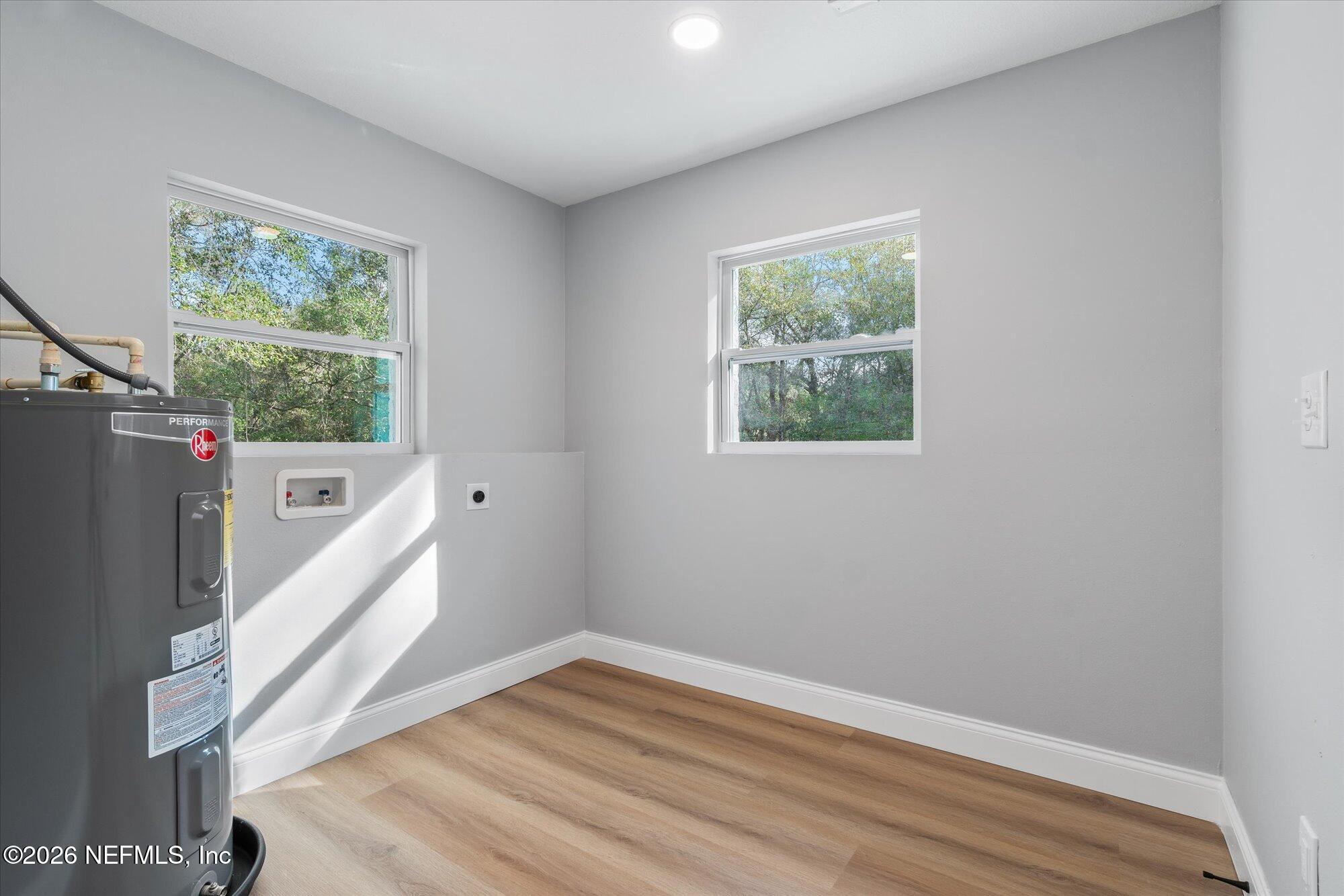 102 Mullins Road Interlachen, FL 32148 - Photo 13 of 45 a view of entryway and hall with wooden floor