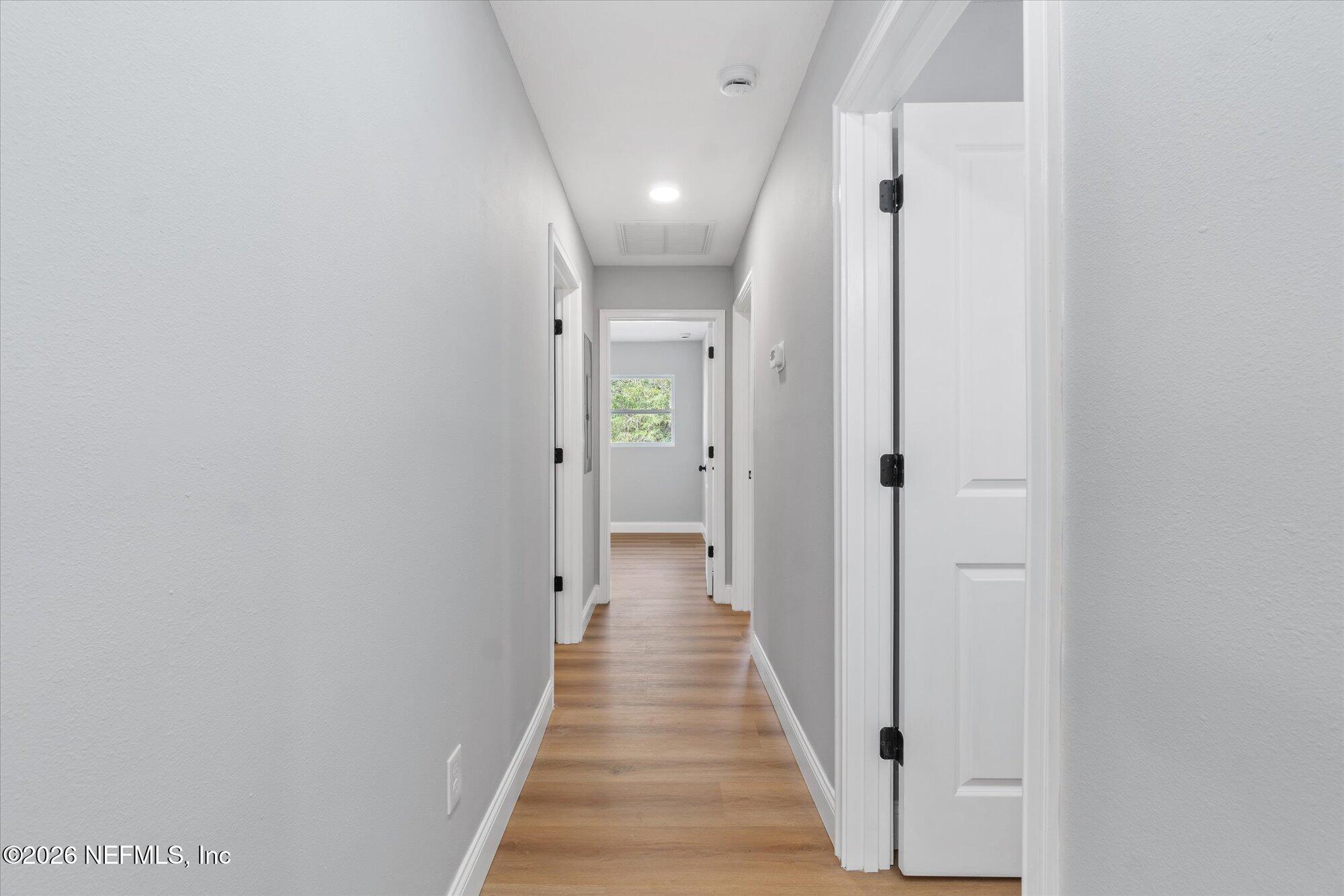 102 Mullins Road Interlachen, FL 32148 - Photo 16 of 45 a view of a hallway with wooden floor and closet