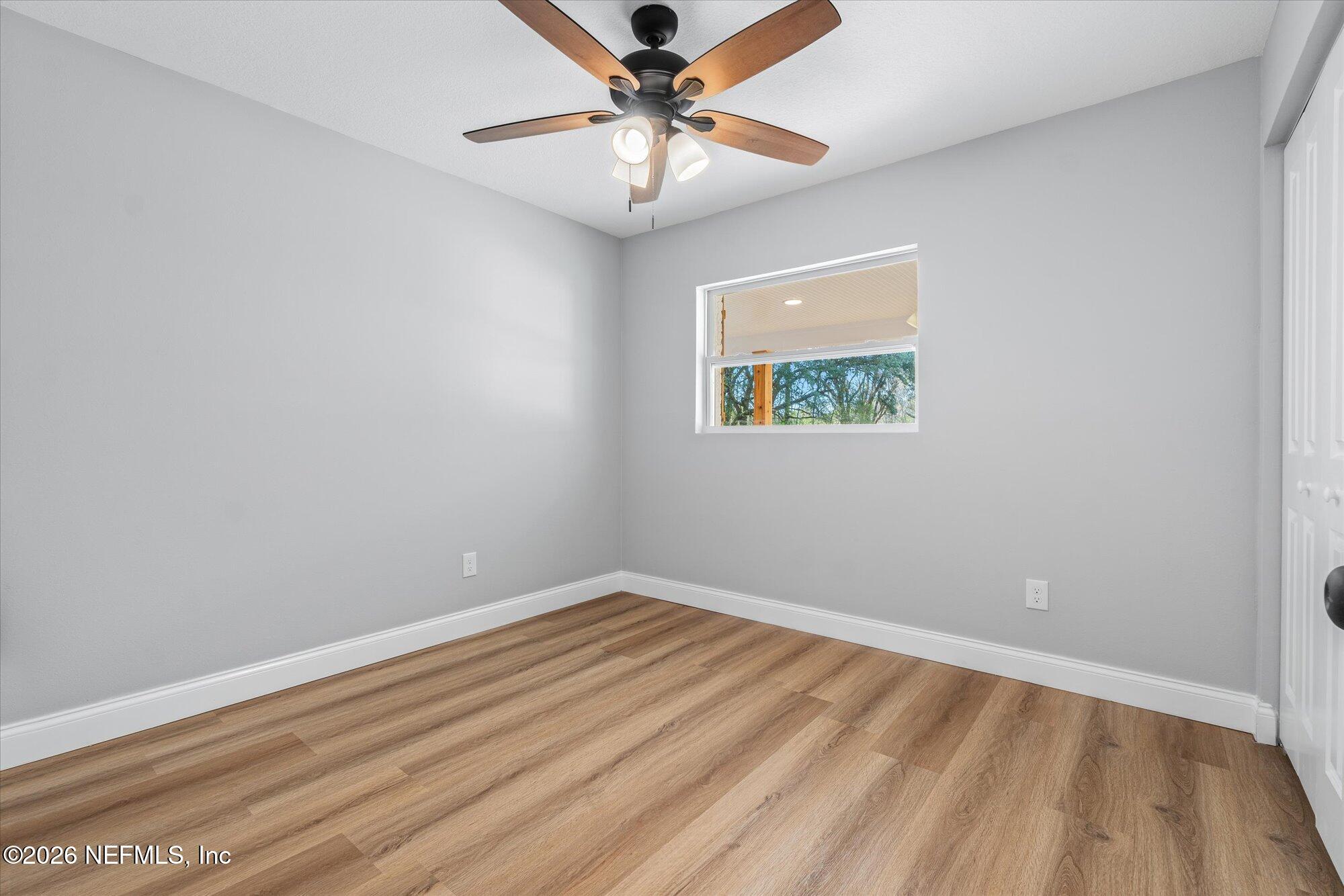 102 Mullins Road Interlachen, FL 32148 - Photo 23 of 45 a view of room with window and ceiling fan