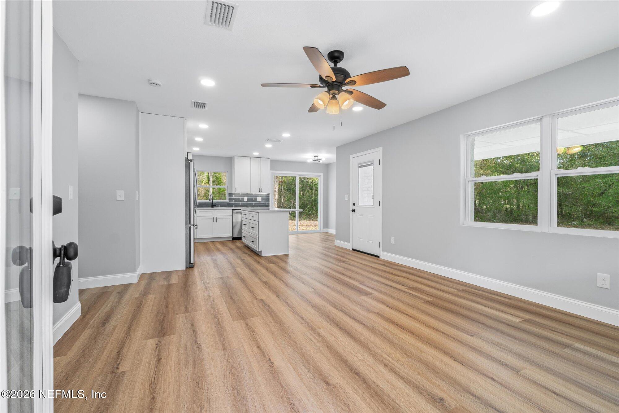 102 Mullins Road Interlachen, FL 32148 - Photo 29 of 45 a view of a living room and a wooden floor