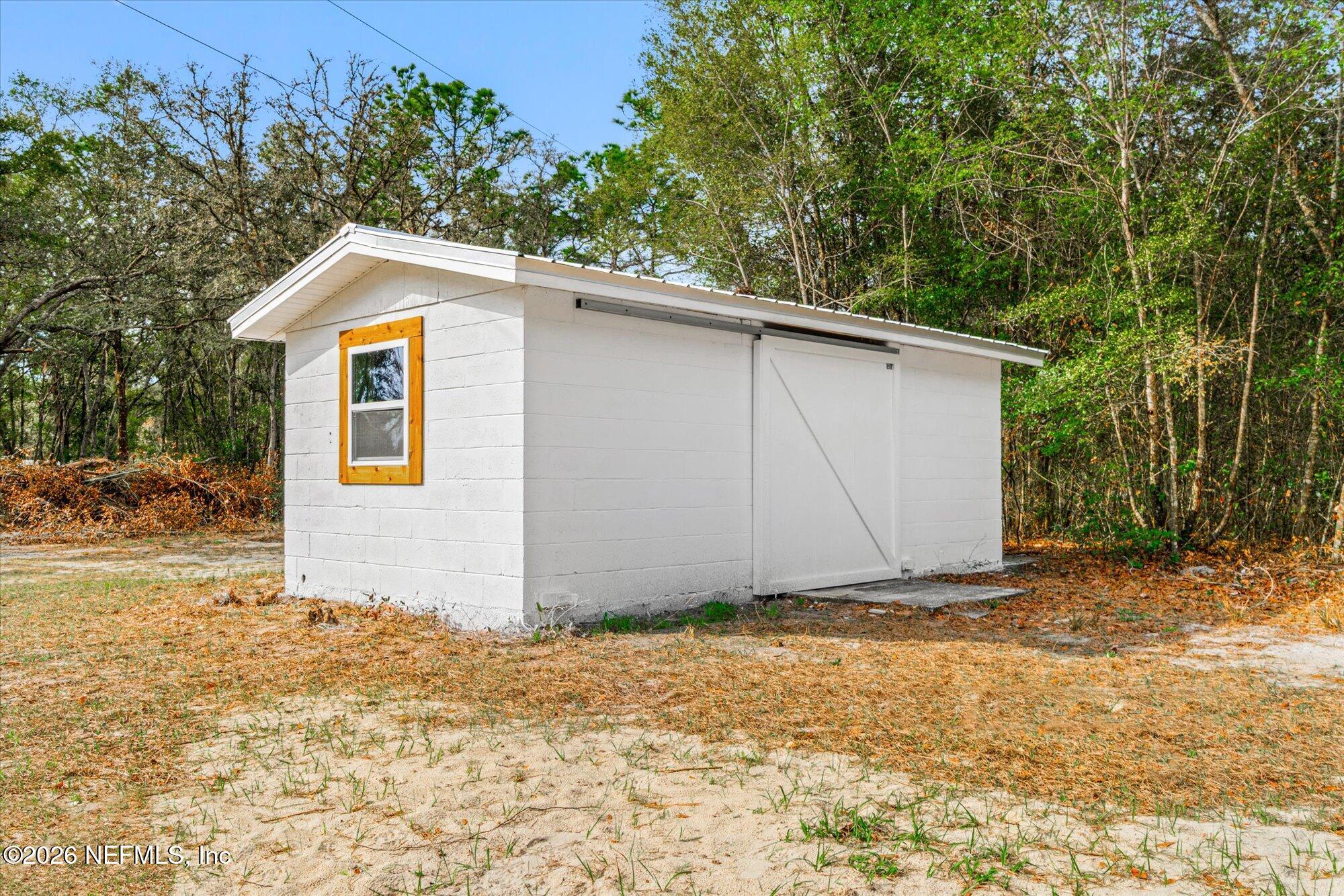 102 Mullins Road Interlachen, FL 32148 - Photo 30 of 45 a house with a yard