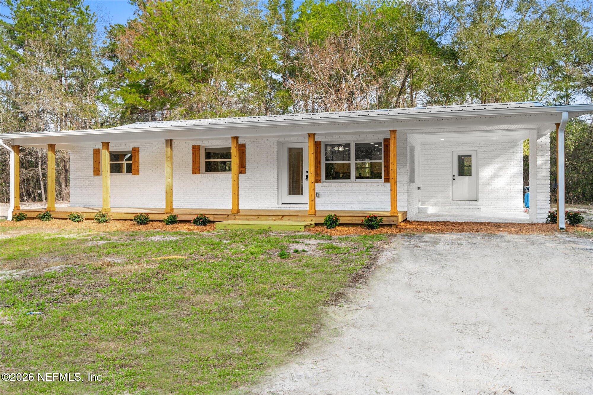 102 Mullins Road Interlachen, FL 32148 - Photo 32 of 45 front view of a house with a yard