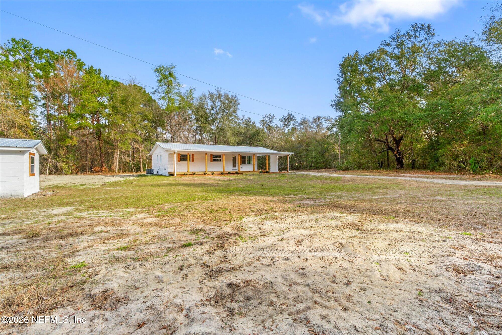 102 Mullins Road Interlachen, FL 32148 - Photo 35 of 45 a view of a house with a big yard