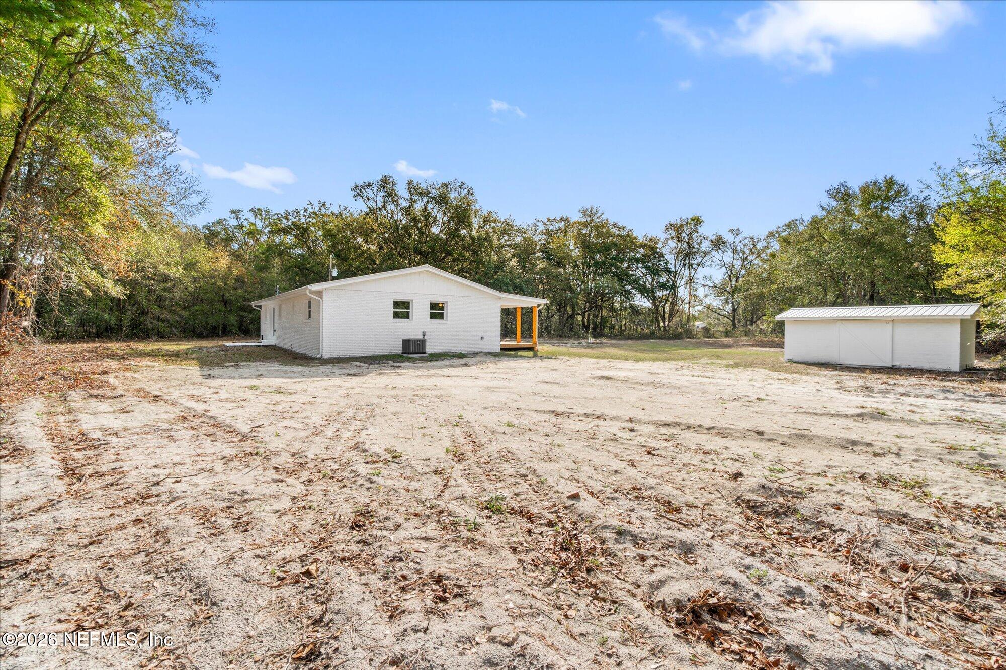 102 Mullins Road Interlachen, FL 32148 - Photo 37 of 45 a view of a dry yard with wooden fence