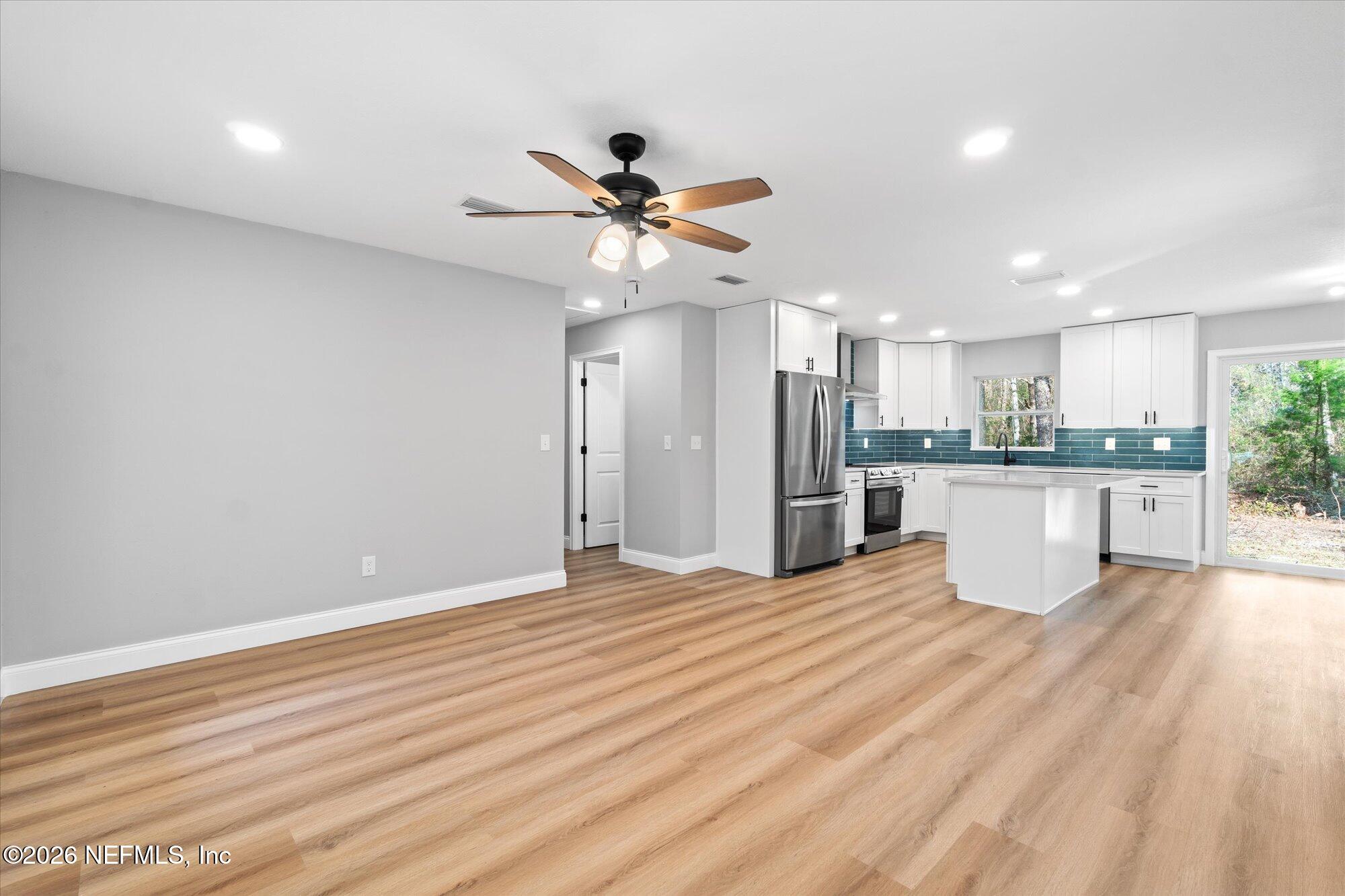 102 Mullins Road Interlachen, FL 32148 - Photo 6 of 45 a view of a kitchen with a sink and a window
