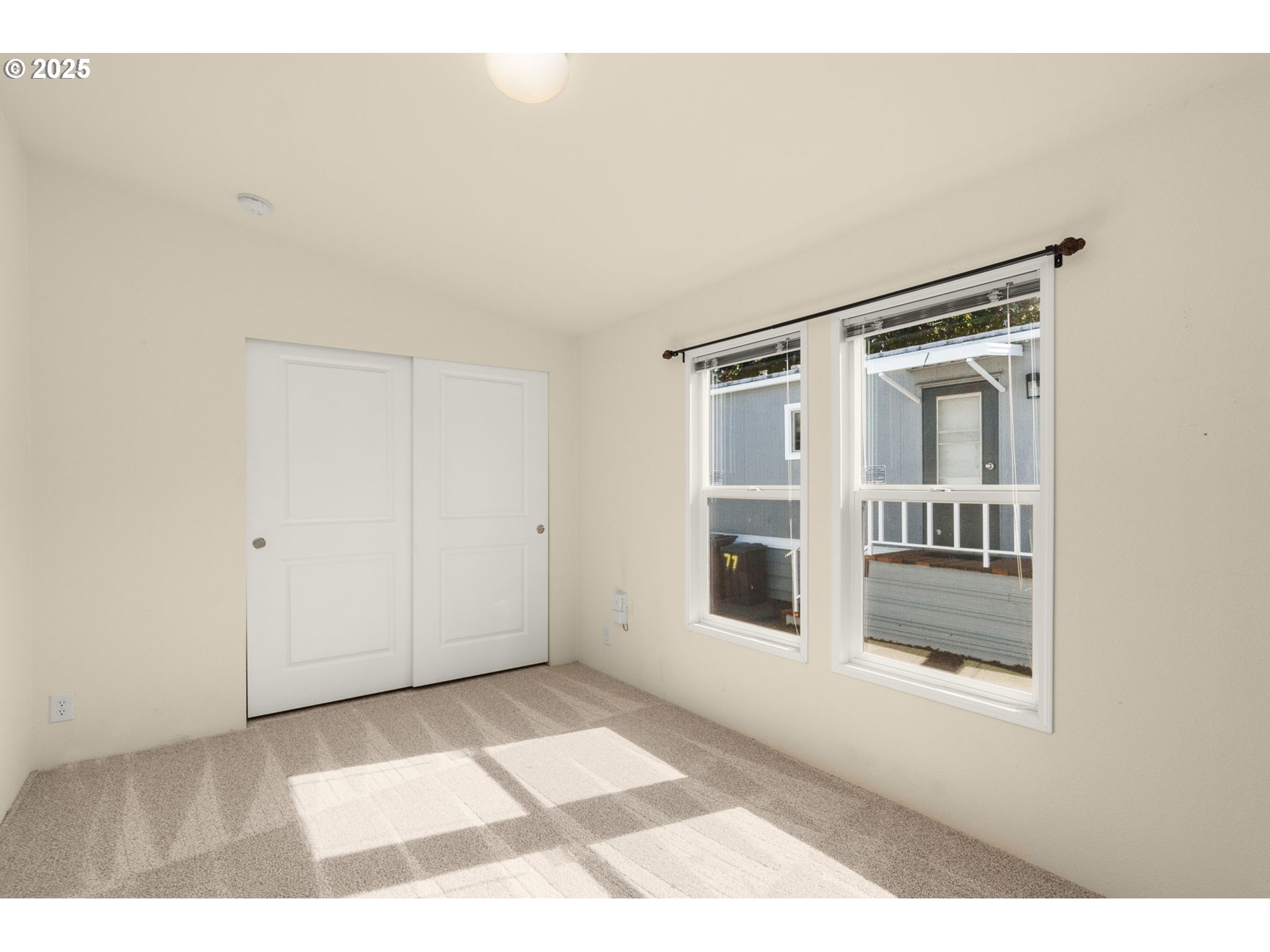 21100 Northeast Sandy Boulevard, Unit 76 Fairview, OR 97024 - Photo 19 of 23 a view of an empty room with a window