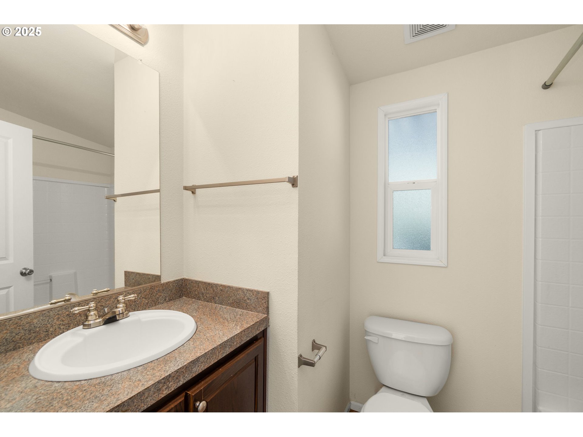 21100 Northeast Sandy Boulevard, Unit 76 Fairview, OR 97024 - Photo 20 of 23 a bathroom with a granite countertop sink toilet and mirror