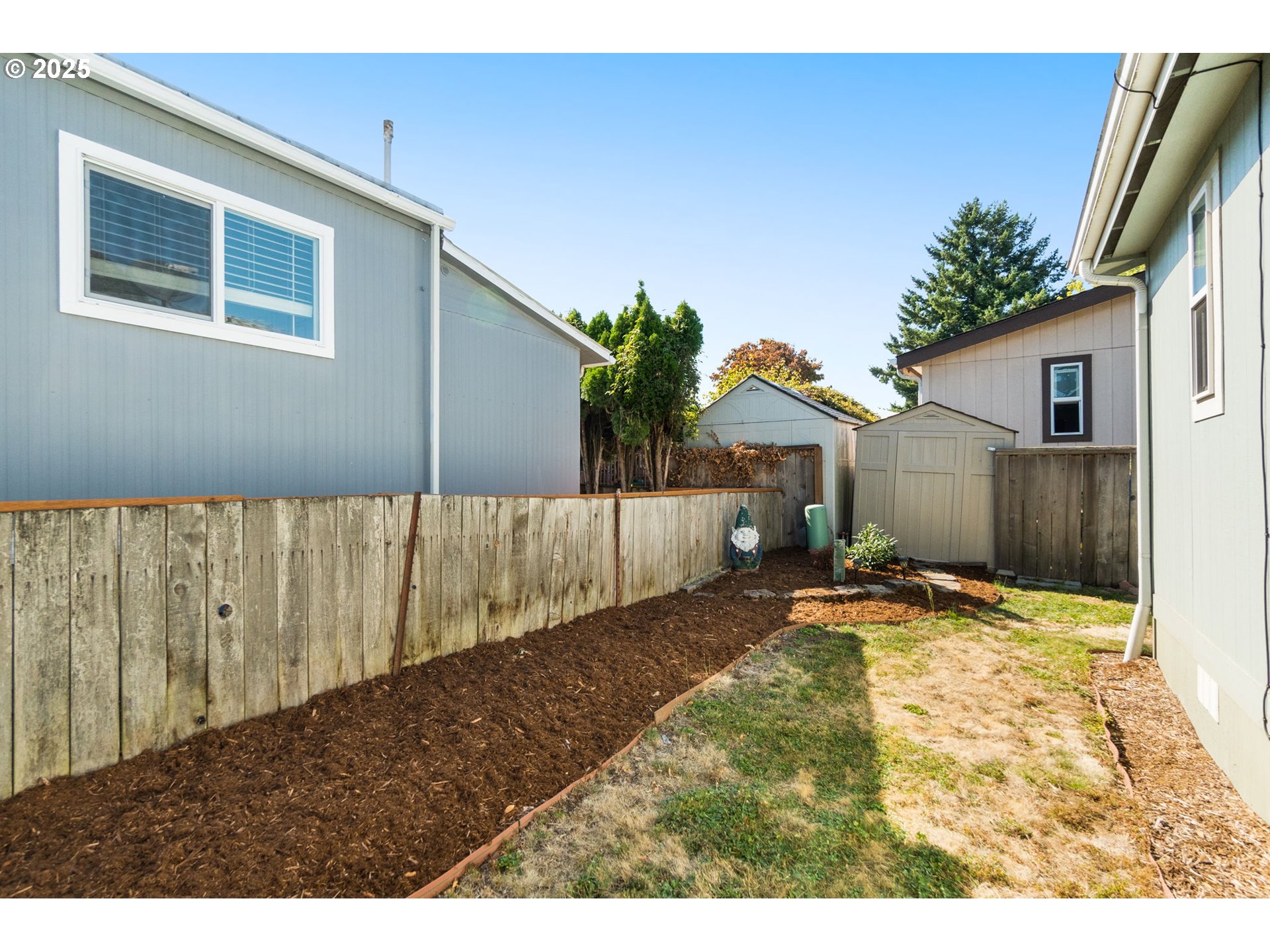 21100 Northeast Sandy Boulevard, Unit 76 Fairview, OR 97024 - Photo 22 of 23 a view of a backyard of a house