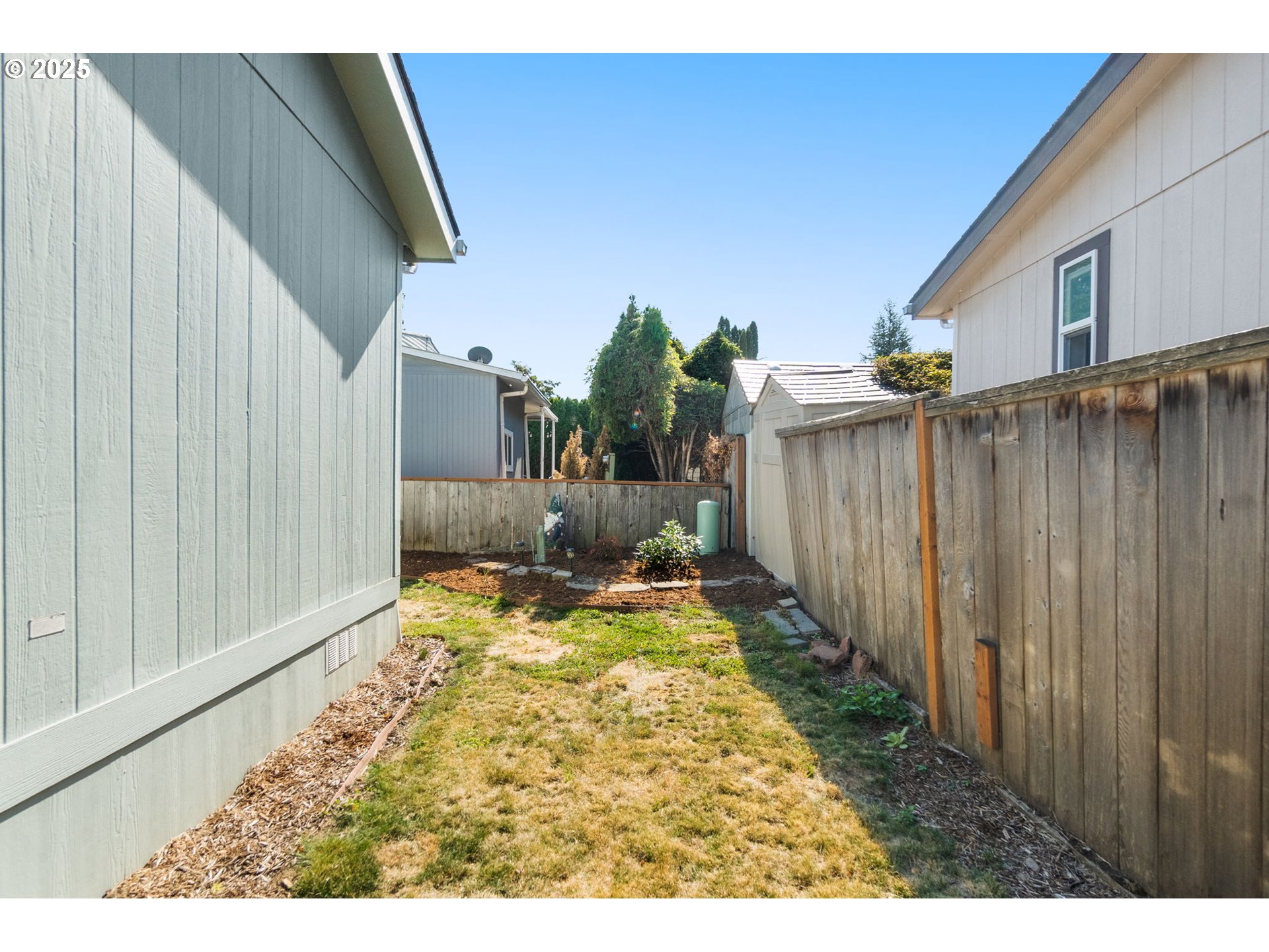 21100 Northeast Sandy Boulevard, Unit 76 Fairview, OR 97024 - Photo 23 of 23 a view of a backyard with pathway