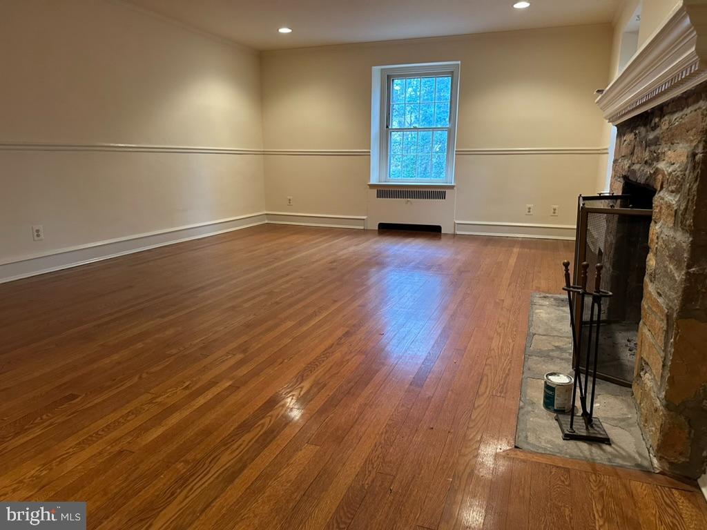 602 Bellevue Road Wilmington, DE 19809 - Photo 17 of 56 an empty room with wooden floor and windows