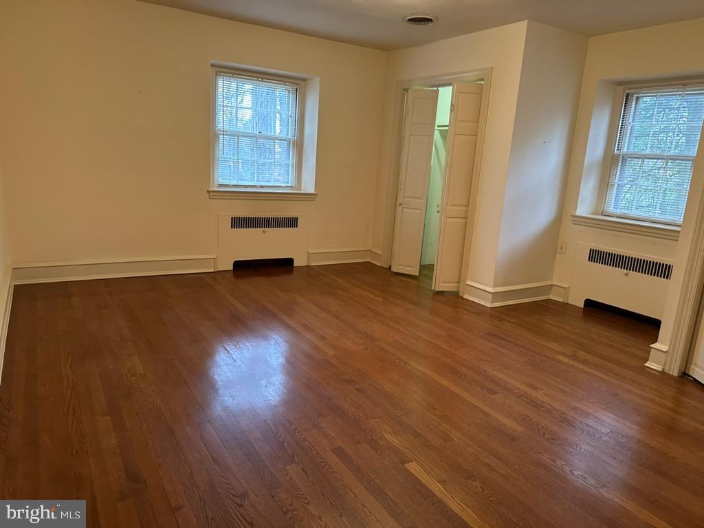 602 Bellevue Road Wilmington, DE 19809 - Photo 24 of 56 an empty room with wooden floor and windows