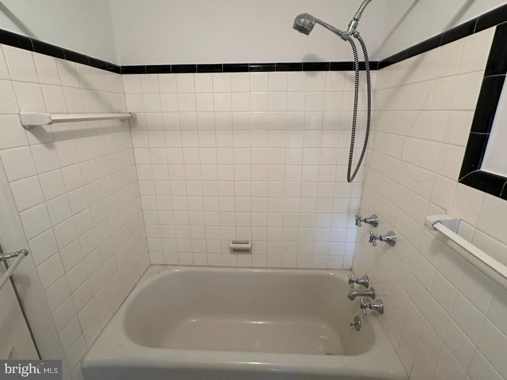 602 Bellevue Road Wilmington, DE 19809 - Photo 32 of 56 a close up of a bathtub in a bathroom