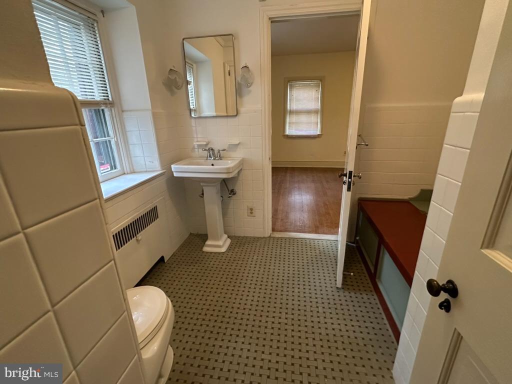 602 Bellevue Road Wilmington, DE 19809 - Photo 36 of 56 a bathroom with a sink a toilet and a mirror