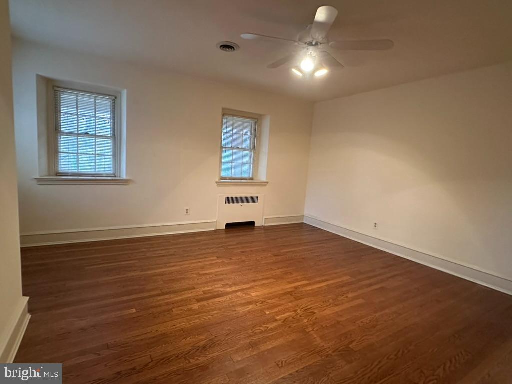 602 Bellevue Road Wilmington, DE 19809 - Photo 37 of 56 an empty room with wooden floor and windows