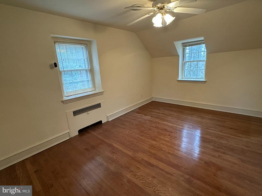 602 Bellevue Road Wilmington, DE 19809 - Photo 42 of 56 a view of an empty room with wooden cabinets and a window