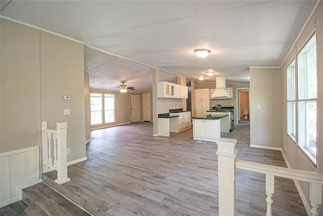 a view of a kitchen with wooden floor